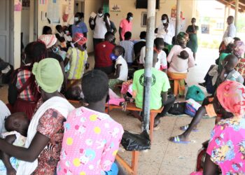 Refugees in Adjumani attend a health talk at Pagirinya Health Centre III courtesy of RHU