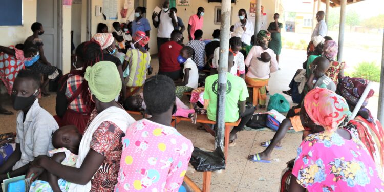 Refugees in Adjumani attend a health talk at Pagirinya Health Centre III courtesy of RHU