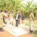 Police officers, PC Amos Kungu's relatives at the grave of the fallen officer