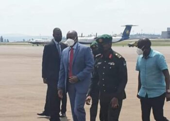 Gen Muhoozi (blue suit) at Kigali International Airport