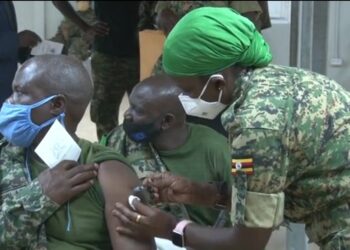 A UPDF soldier receiving his Covid-19 vaccine booster shot