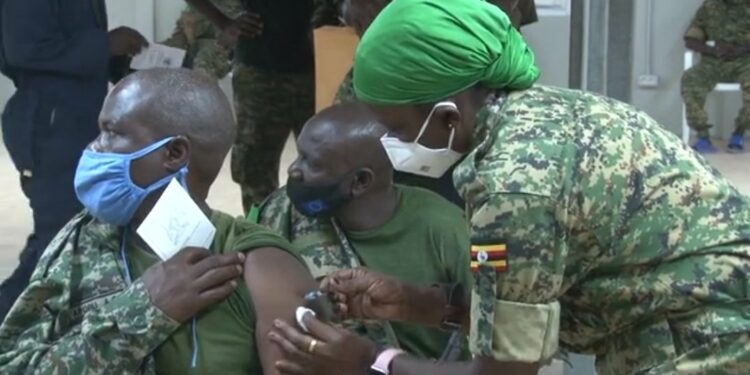 A UPDF soldier receiving his Covid-19 vaccine booster shot