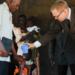 Eric-Tuininga-baptising-a-child-in-Mbale
