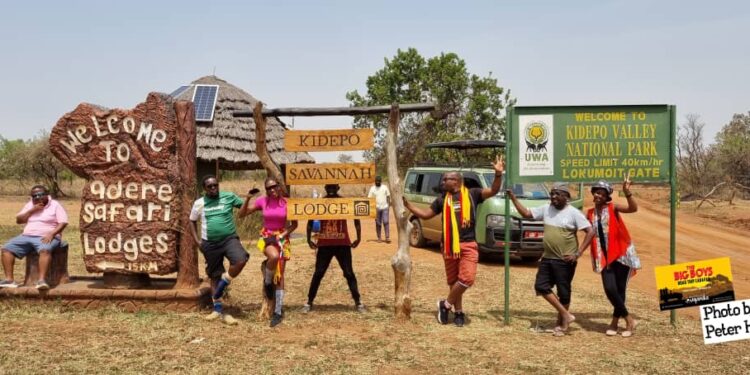 The caravan crew members pose for a photo at Kidepo Valley National park