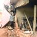 Minister Nabakooba inspecting one of the destroyed houses in Kitende