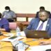 Dr Balinda (with mask) before the committee chaired by Hon Ababiku (R)