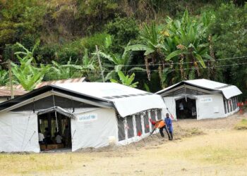 An aerial view of a High Performance Tent classroom installed at Bulembia Primary School in Kasese district. This school is a beneficiary of the UNICEF HPTs because its classrooms were washed away by a flooding neighboring River Nyamwamba. This rendered pupils to squeeze in a few remaining classrooms while others studied under the trees. UNICEF is offering these new improved multipurpose tents for emergencies. This was on January February 1, 2022.
PHOTO BY MARIA WAMALA/UNICEF