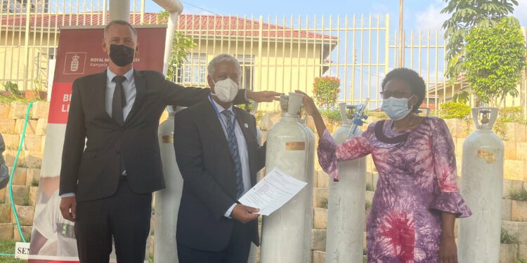 Minister Aceng receives oxygen cylinders from Denmark officials