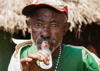 A man enjoying waragi