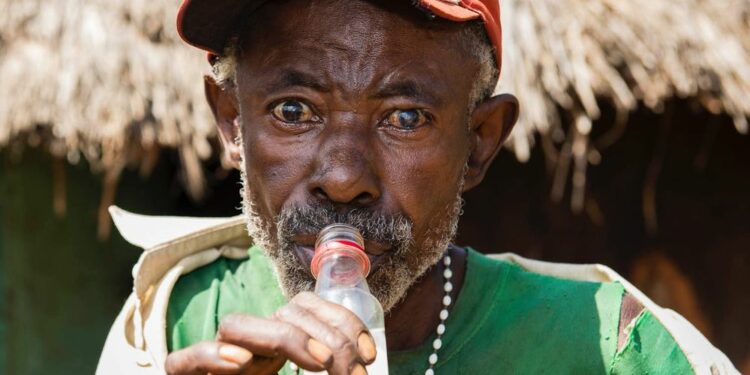 A man enjoying waragi