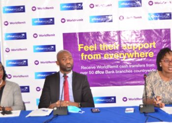 Left -  Right: Faridah Nalubega, Manager Cards and Money Transfer, Ivan Kanyali, Uganda Country Manager at WorldRemit and Miranda Bageine Musoke, Head of Personal Banking at dfcu Bank during the launch of the partnership today at dfcu Bank HQ.