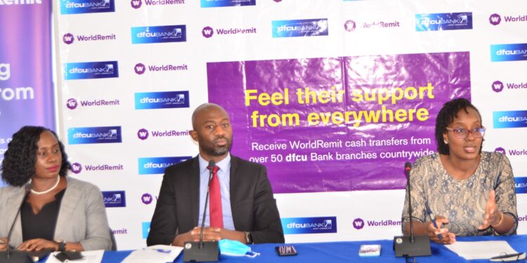 Left -  Right: Faridah Nalubega, Manager Cards and Money Transfer, Ivan Kanyali, Uganda Country Manager at WorldRemit and Miranda Bageine Musoke, Head of Personal Banking at dfcu Bank during the launch of the partnership today at dfcu Bank HQ.