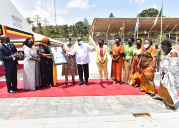 President Yoweri Museveni and the First Lady / Minister of Education and Sports Janet Museveni receiving a portrait Photo of The Late Esteri Kokundeka from the Chairperson National Women’s council Faridah Kibowa also present are members of the National Womens’s Council during the International Women’s day celebrations at Kololo ceremonial Grounds on 8th March 2022. Photo by PPU/ Tony Rujuta.
