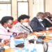 Minister Anite (R) appearing before the committee with officials from UETCL