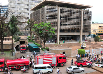 Fire brigade vehicles parked at the Western wing of the Central bank in Kampala after it gut on fire at around 1:30 in the afternoon. According to the Manager of Communication Christine Alupo at the bank, the cause of the fire is un identified but investigations are going on. She adds that also unspecified amount of property was destroyed. All the employees had to move out of the building as fire was being put off. PHOTO BY ABUBAKER LUBOWA.