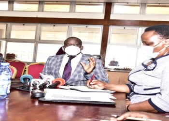 Hon Nyakikongoro, the chair of the Defence committee (R), Hon Karubanga (C) and Hon Opendi during the committee meeting