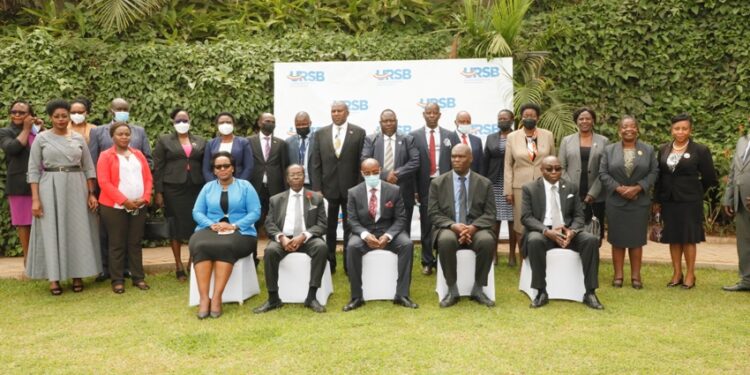 Registrar General  Mercy Kainobwisho,URSB Board Chair Ambassador Francis Butagira, Principal Judge Dr.Flavian Zeija, Justice Mike Chibita, Justice Geoffrey Kiryabwire in a group photo during the insolvency conference