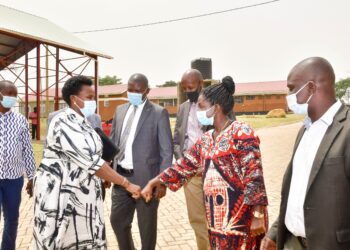 State House Comptroller Jane Barekye interacts with Mbale RDC Sumini Nasike as other leaders look on during a pre-launch meeting of Mbale and Kween industrial hubs in Lukhonge hub Friday