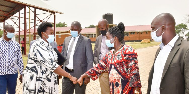 State House Comptroller Jane Barekye interacts with Mbale RDC Sumini Nasike as other leaders look on during a pre-launch meeting of Mbale and Kween industrial hubs in Lukhonge hub Friday