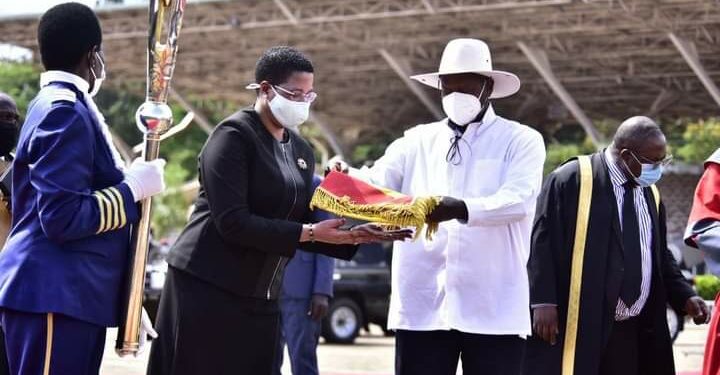 President Yoweri Museveni handing over instruments of power to Rt Hon Anita Among