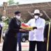 President Yoweri Museveni handing over instruments of power to Rt Hon Anita Among