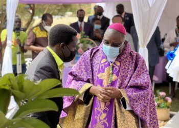 Archbishop Ssemogerere with herbalist David Ssenfuka