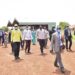 Madi Sub-region Industrial Zonal Hub in Adjumani Hub Manager Robert Aluma Mamawi leading a team of political leaders  from Adjumani Obongi and Moyo district in attendance were the Political leaders from the West Nile districts as the tour the Madi Sub-region Industrial Zonal Hub in Adjumani on 31st March 2022. Photo by PPU / Tony Rujuta.