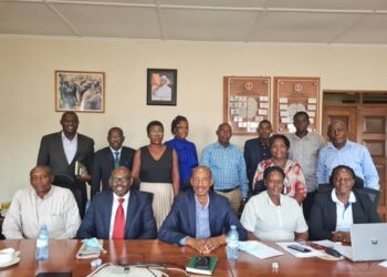 Ambassador Fred Mugisha (3rd right) and David Katungi (2nd left), the Director of Strategy and Business Development at UCDA in a photo moment with exporters