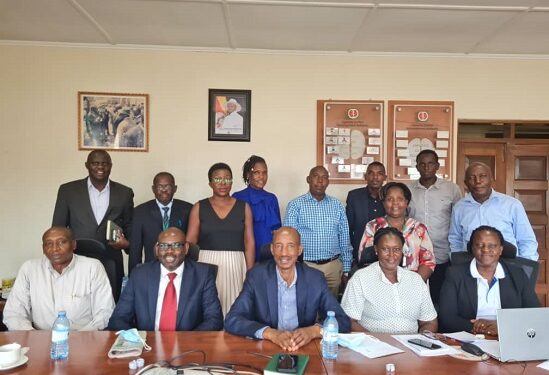 Ambassador Fred Mugisha (3rd right) and David Katungi (2nd left), the Director of Strategy and Business Development at UCDA in a photo moment with exporters