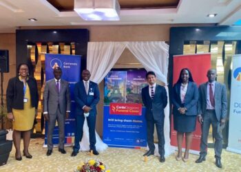 Fabian Kasi the Managing Director at Centenary Bank (3rd left) and Mr. Arjun Mallik then CEO Prudential Eastern and Central Africa (3rd right) alongside other officials from the Bank and Prudential Uganda pose for a photo during the launch of the Diaspora Funeral Cover at Mapeera House. The bank rolled out several innovations in 2021 on which it is hedging its future growth.