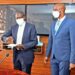 Finance minister Matia Kasaija (2nd left) exchanges documents with Enrica Pinetti (left) after signing an agreement with the Finance ministry to establish a coffee processing plant in Uganda