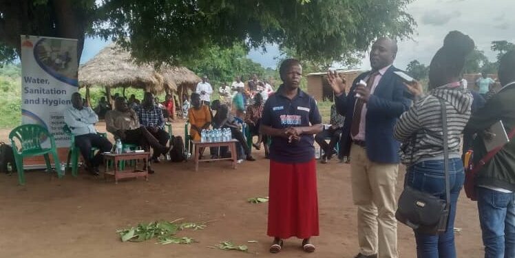 Deputy RDC Alebtong - Odongo Stephen speaks during the commissioning of the borehole in Abako sub county, Alebtong district