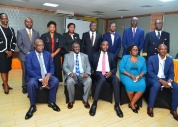 Seated from right: Finance Ministry PS Ramadhan Ggoobi, New board Chair Priscilla Mirembe Serukka, Minister of State for Finance Henry Musasizi, works and Transport Minister Gen Katumba Wamala and Ministry of Transport PS Waiswa Bageya