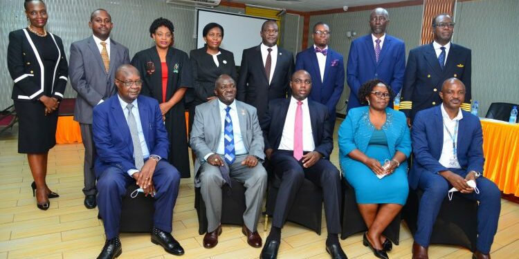 Seated from right: Finance Ministry PS Ramadhan Ggoobi, New board Chair Priscilla Mirembe Serukka, Minister of State for Finance Henry Musasizi, works and Transport Minister Gen Katumba Wamala and Ministry of Transport PS Waiswa Bageya