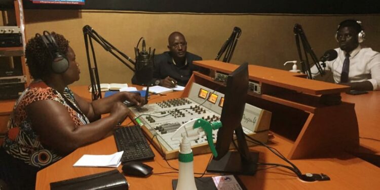 Kagadi RDC and his Deputy in the studios of Kagadi-Kibale Community Radio (KKCR)