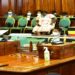 Kiryowa Kiwanuka (standing) makes his point during the committee stage of processing of the bill