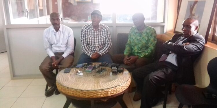 Pierre Mbabazi with the head of laity Diocese of KIGEZI and Canon Ivan Batuma
