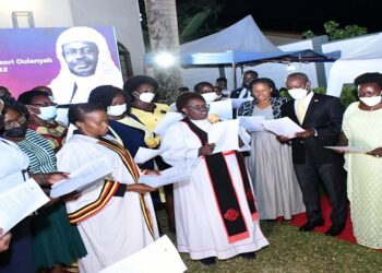 MPs led by the Deputy Speaker, Thomas Tayebwa (3rd R) join in singing of a hymn during the service