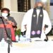 The clergy lead prayers at the home of the former speaker