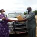 Minister Babalanda hands over a car to one of the RDCs