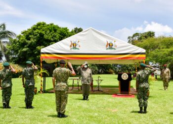 CDF Gen Mbadi (C) and a team of five officers salute the Commander in Chief Gen Museveni during the high command meeting at Entebbe