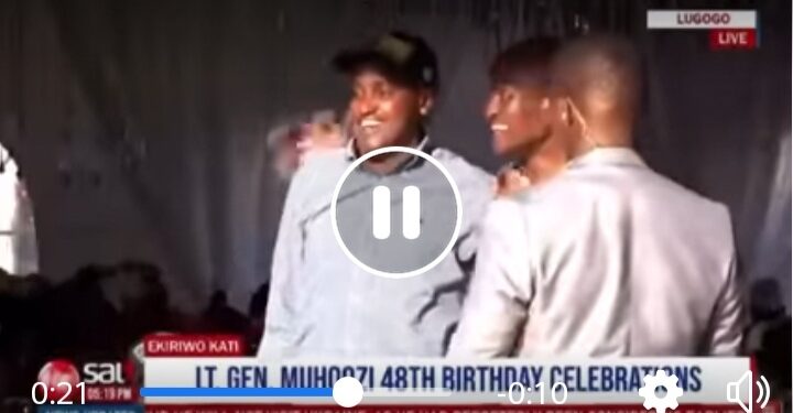 Tamale Mirundi and Minister Frank Tumwebaze hug during  Gen Muhoozi's birthday party