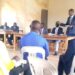 Kagadi Deputy Resident District Commissioner Tumusiime, DISO in a meeting with district councilors and other officials