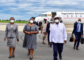 President Museveni chats with Head of Public Service Lucy Nakyobe (L) and Minister for  Presidency Milly Babalanda on his return from Nairobi, Kenya on Tuesday April 21