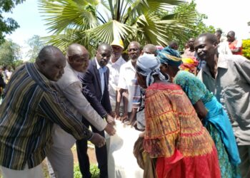 DRDC Trevor Solomon Baleke with some of the beneficiaries of the relief aid