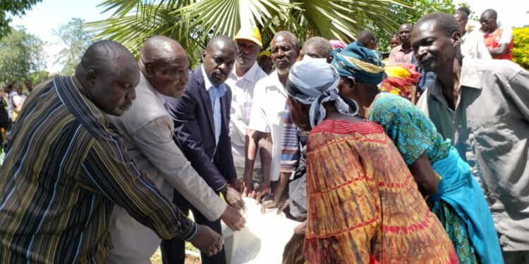 DRDC Trevor Solomon Baleke with some of the beneficiaries of the relief aid