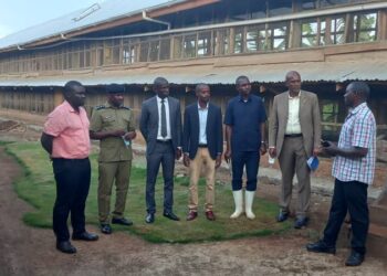 Fort Portal D/RCC Mr Businge Emmanuel with other officials at Mr Richard Nyakana's farm.