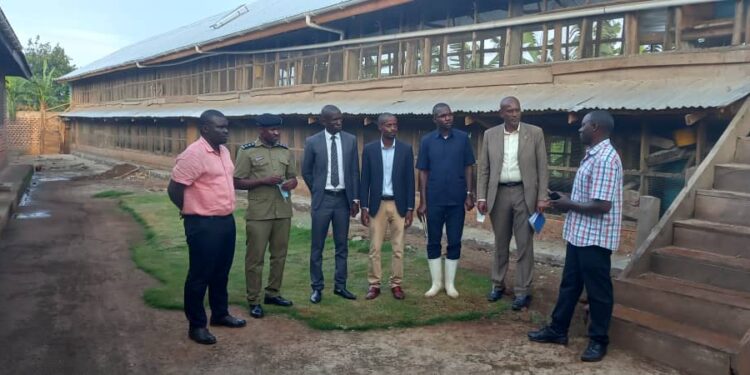 Fort Portal D/RCC Mr Businge Emmanuel with other officials at Mr Richard Nyakana's farm.