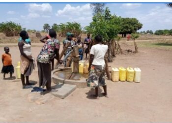 Locals in Onyol central village fetching water from the only borehole that serves over 12,000 people. It’s the only clean water point/ borehole in Baradanga parish in Omot sub county, Agago district.