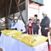 President Yoweri Museveni signs one of the 50 Kgs packed sacks of Crest Sugar in the Presences of the Kiryandongo Sugar Ltd Owners during the official commissioning of the Kiryandongo Sugar Ltd Factory in Kiryandongo District on 14th May 2022. Photo by PPU/ Tony Rujuta